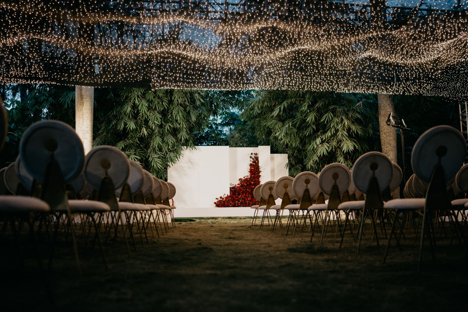 Ceremony seating beneath the fairy-light canopy